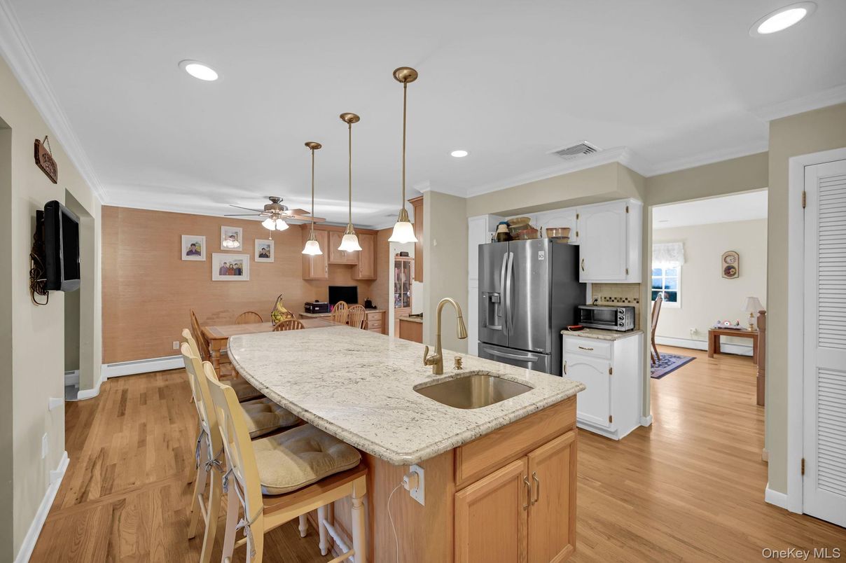 Dining room, Interior, Kitchen, Pendant Lights, Recessed Lighting, Stainless Steel Appliances, Wood Texture Flooring