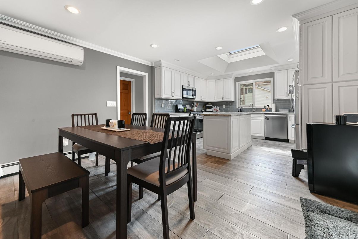 Dining room, Interior, Kitchen, Recessed Lighting, Stainless Steel Appliances, Wood Texture Flooring