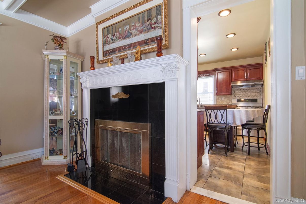 Fireplace, Interior, Kitchen, Recessed Lighting, Stainless Steel Appliances, Wood Texture Flooring