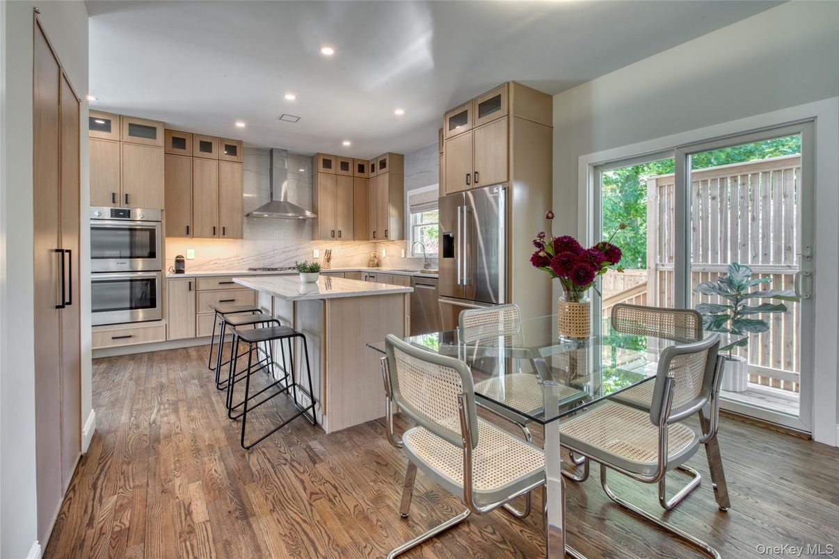 Dining room, Interior, Kitchen, Recessed Lighting, Stainless Steel Appliances, Wood Texture Flooring