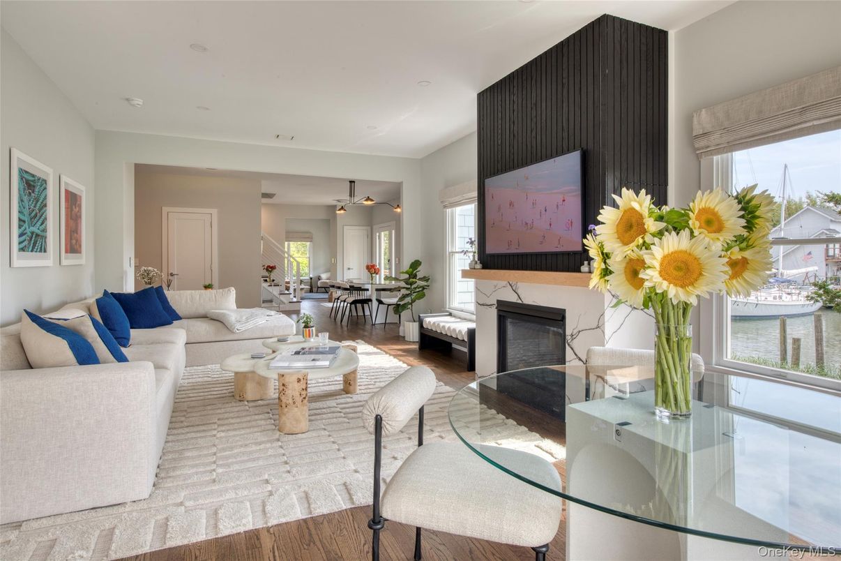 Dining room, Fireplace, Interior, Living room, Pendant Lights, Recessed Lighting, Wood Texture Flooring
