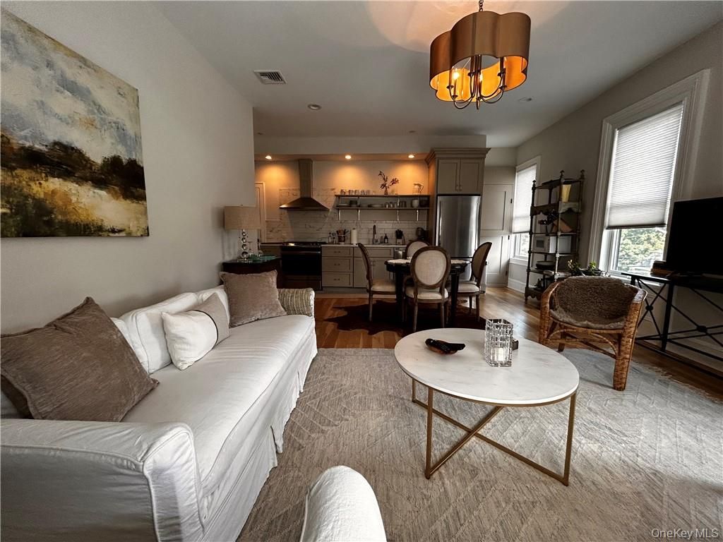 Chandelier, Dining room, Interior, Kitchen, Living room, Recessed Lighting, Stainless Steel Appliances, Wood Texture Flooring