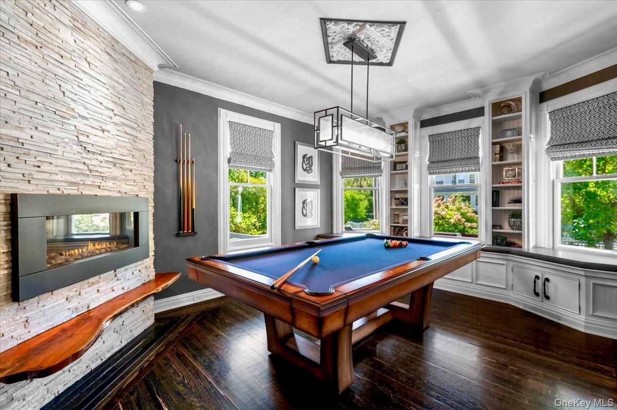 Billiard Table, Fireplace, Game Room, Interior, Pendant Lights, Stone Walls, Wood Texture Flooring