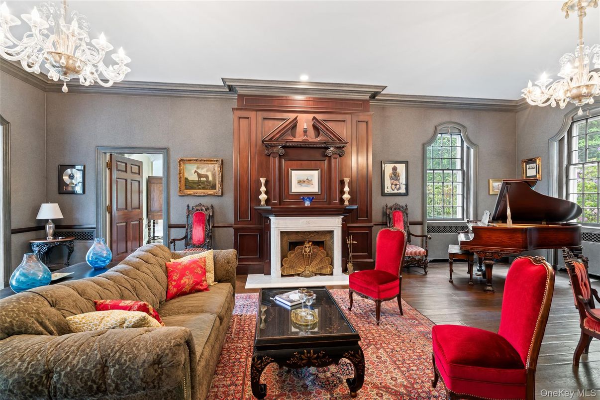 Chandelier, Fireplace, Interior, Living room, Piano, Recessed Lighting, Wood Texture Flooring, Wooden Walls