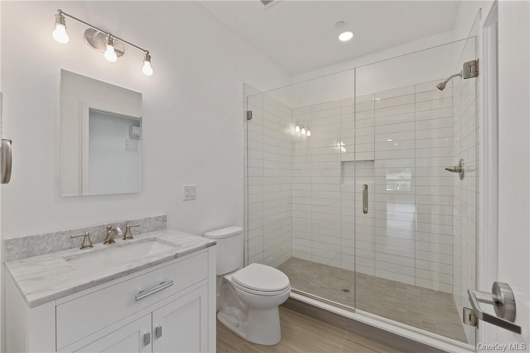 Bathroom, Glass Shower, Interior, Recessed Lighting, Wood Texture Flooring