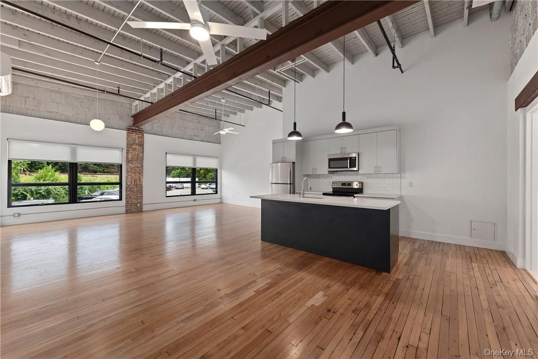 Empty room, Interior, Kitchen, Pendant Lights, Stainless Steel Appliances, Wooden Beams, Wood Texture Flooring