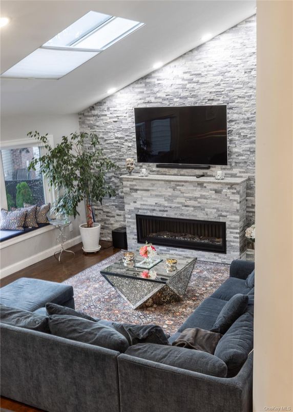 Fireplace, Interior, Living room, Recessed Lighting, Stone Walls, Wood Texture Flooring