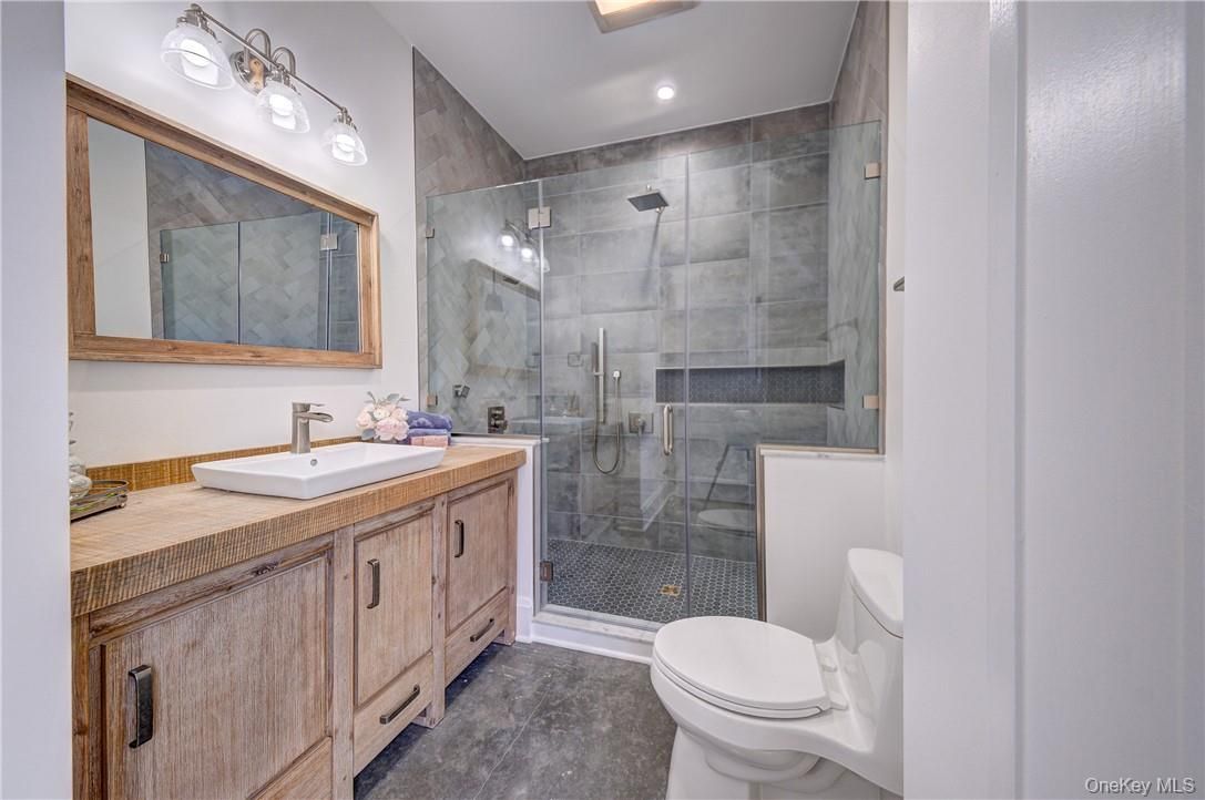 Bathroom, Dual Sink Vanities, Glass Shower, Interior, Recessed Lighting, Tile Countertops