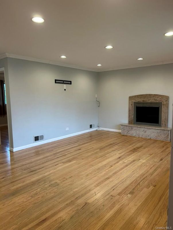 Empty room, Fireplace, Interior, Recessed Lighting, Wood Texture Flooring