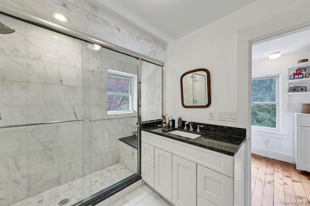 Bathroom, Glass Shower, Interior, Marble Walls, Recessed Lighting, Wood Texture Flooring
