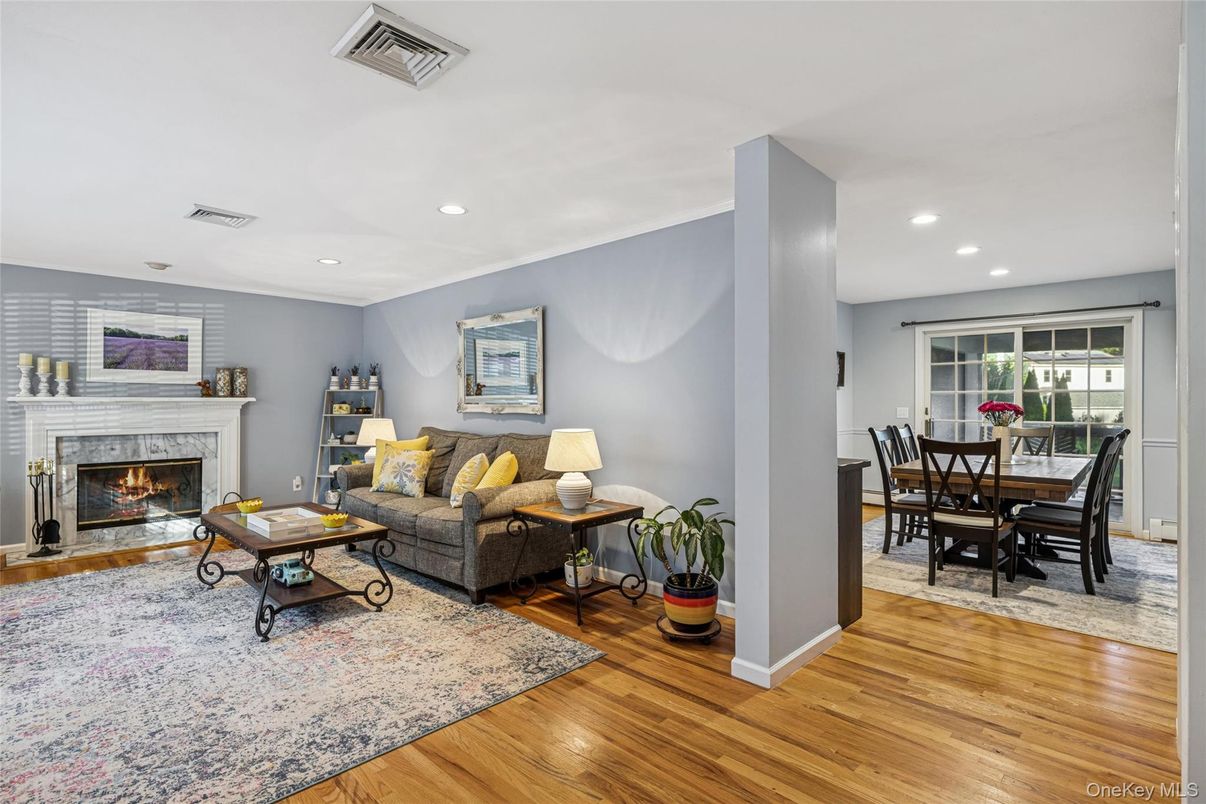 Dining room, Fireplace, Interior, Living room, Recessed Lighting, Wood Texture Flooring