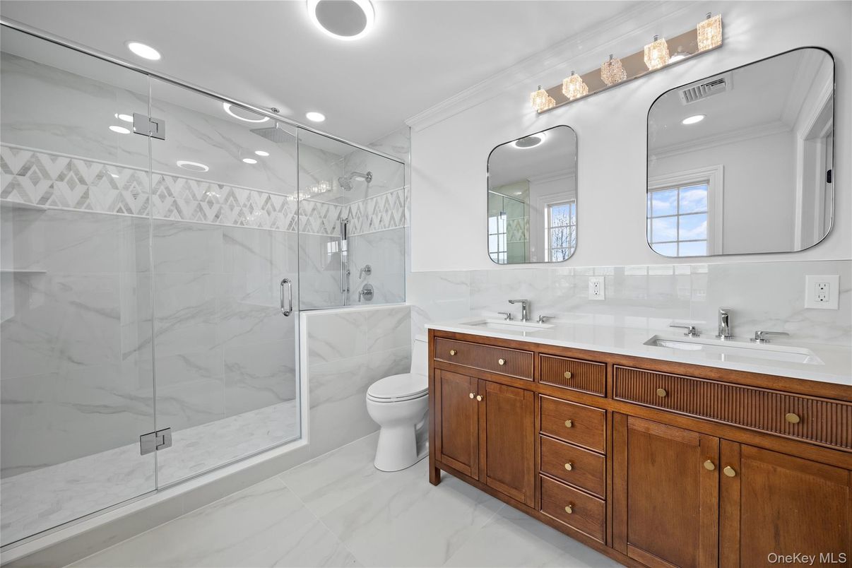 Bathroom, Dual Sink Vanities, Glass Shower, Interior, Marble, Marble Walls, Recessed Lighting