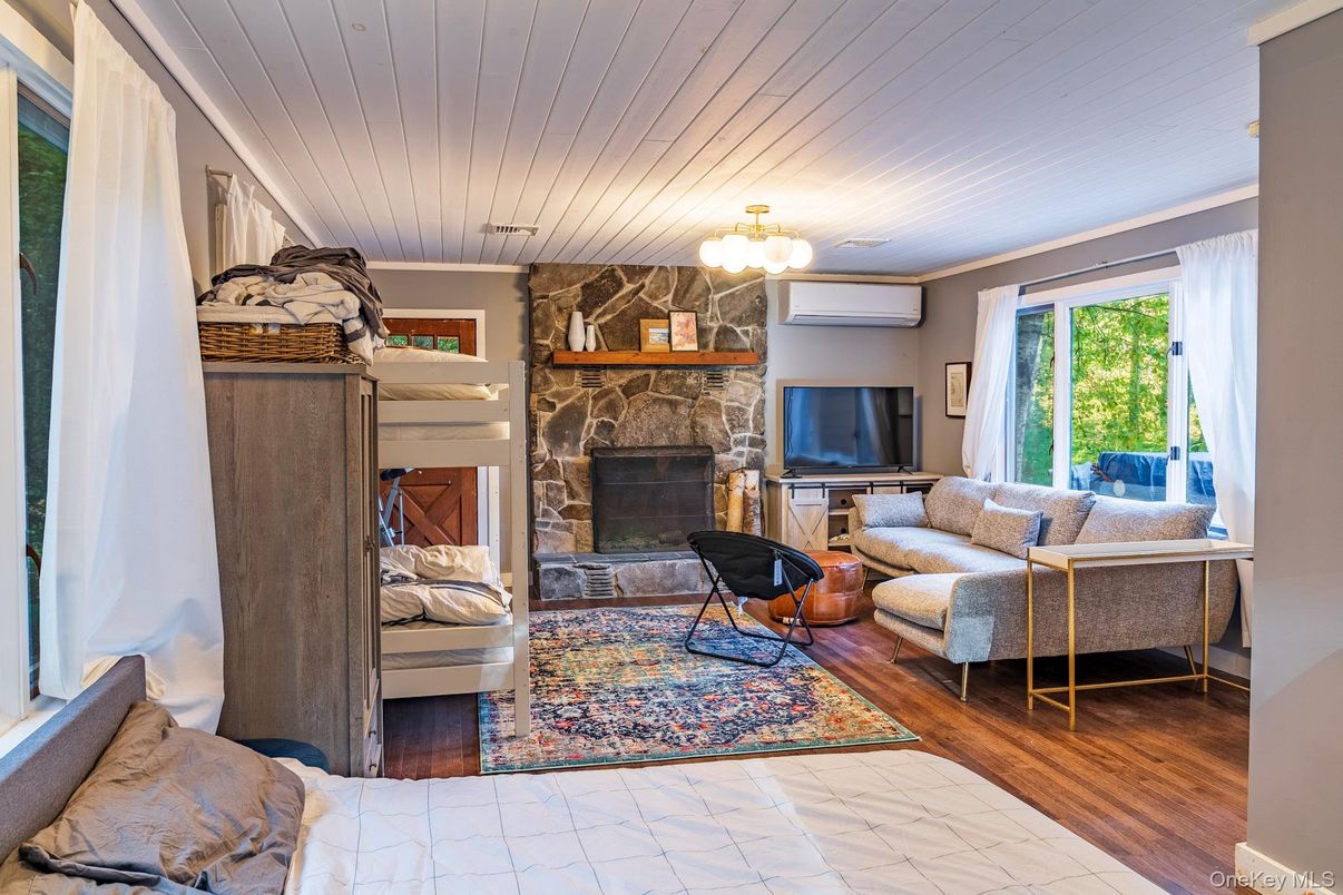 Chandelier, Fireplace, Interior, Living room, Stone Walls, Wood Texture Flooring