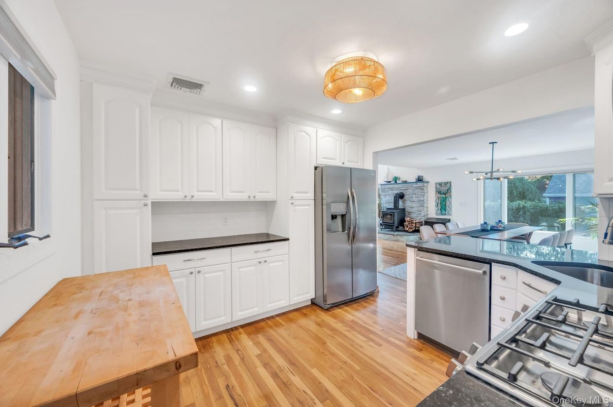 Dining room, Interior, Kitchen, Pendant Lights, Recessed Lighting, Stainless Steel Appliances, Wood Texture Flooring