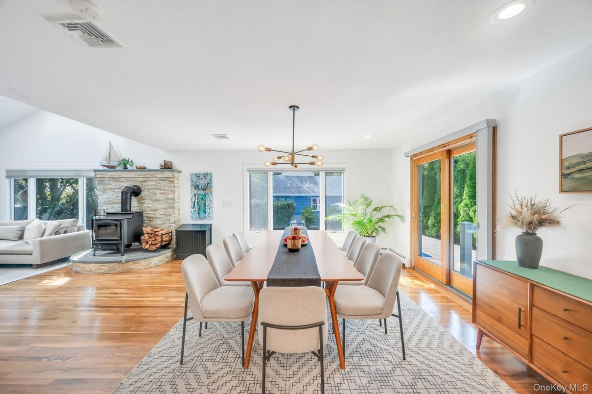Dining room, Fireplace, Interior, Pendant Lights, Recessed Lighting, Stone Walls, Wood Texture Flooring