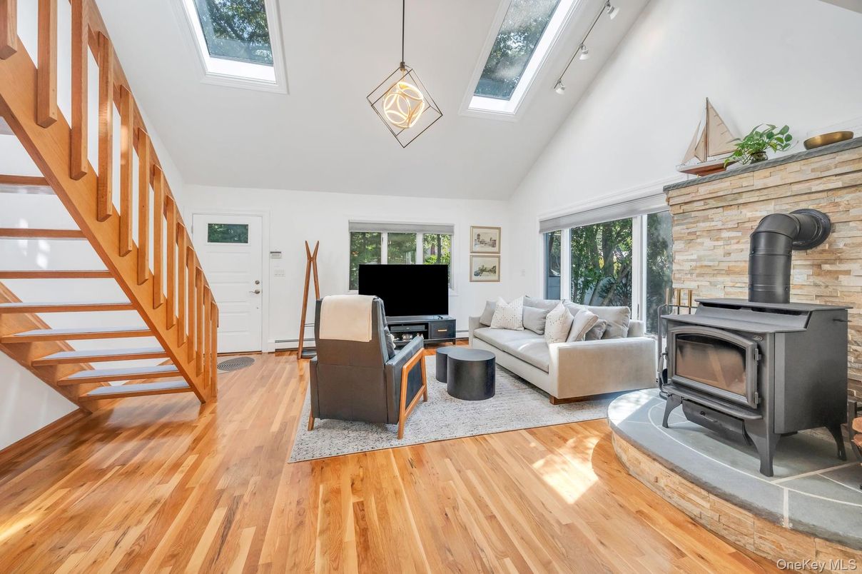 Fireplace, Interior, Living room, Pendant Lights, Stone Walls, Wood Texture Flooring