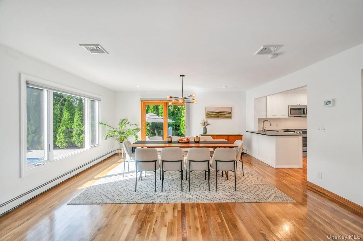 Dining room, Interior, Kitchen, Pendant Lights, Recessed Lighting, Stainless Steel Appliances, Wood Texture Flooring