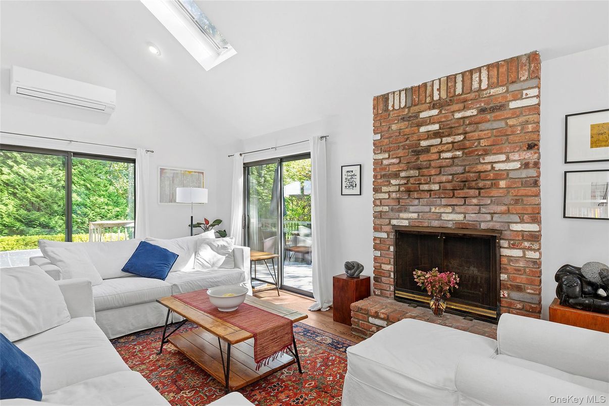 Fireplace, Interior, Living room, Recessed Lighting, Stone Walls, Wood Texture Flooring