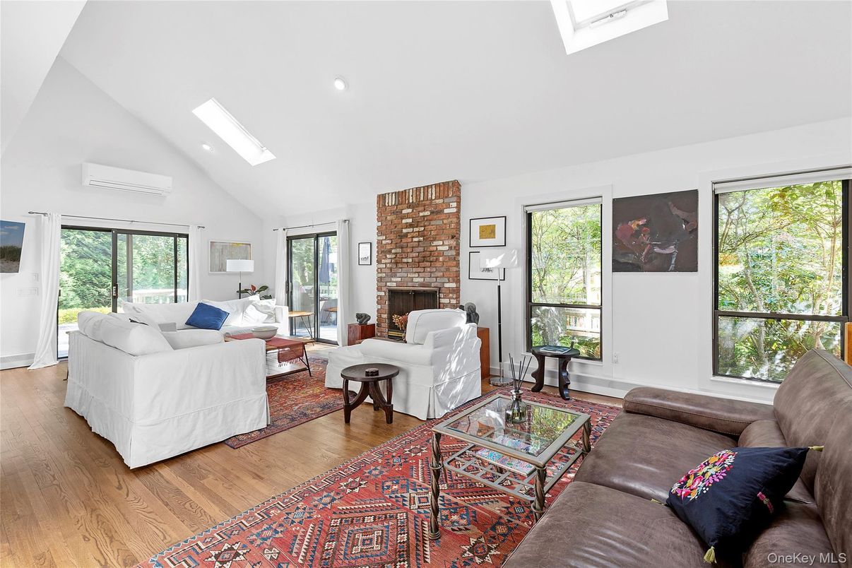 Fireplace, Interior, Living room, Recessed Lighting, Stone Walls, Wood Texture Flooring