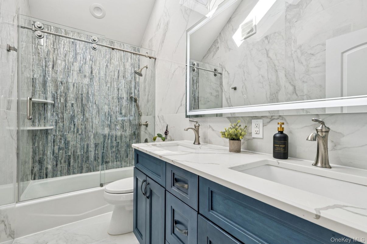 Bathroom, Dual Sink Vanities, Glass Shower, Interior, Marble, Marble Walls, Recessed Lighting