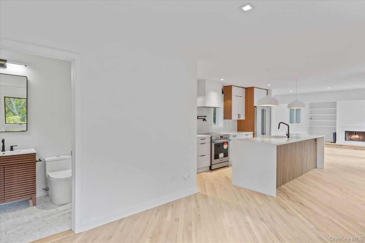 Fireplace, Interior, Kitchen, Pendant Lights, Recessed Lighting, Stainless Steel Appliances, Wood Texture Flooring