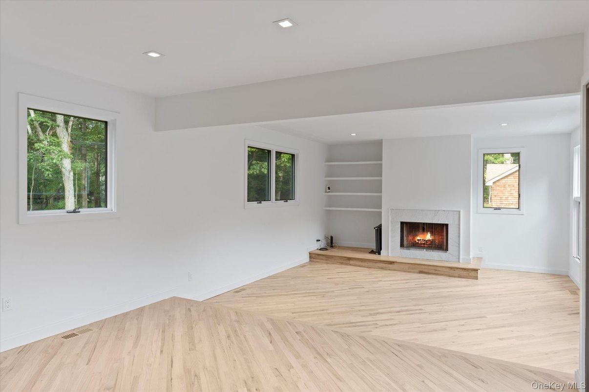 Empty room, Fireplace, Interior, Recessed Lighting, Wood Texture Flooring