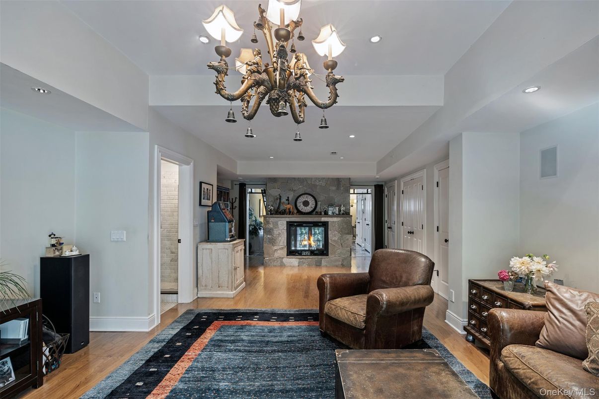 Chandelier, Fireplace, Interior, Living room, Recessed Lighting, Wood Texture Flooring
