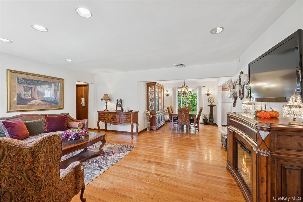 Chandelier, Dining room, Fireplace, Interior, Living room, Recessed Lighting, Wood Texture Flooring