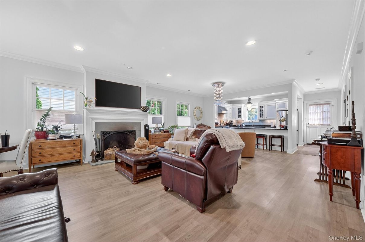 Chandelier, Dining room, Fireplace, Interior, Living room, Pendant Lights, Recessed Lighting, Wood Texture Flooring