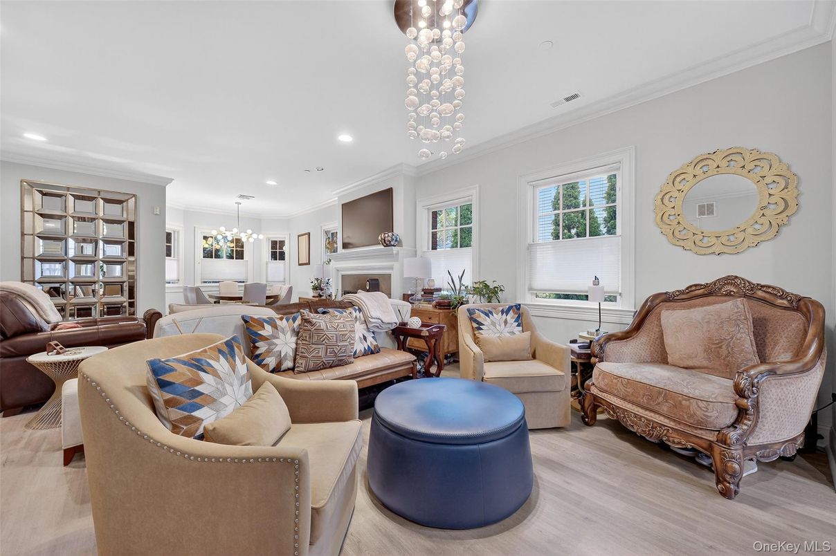Chandelier, Dining room, Fireplace, Interior, Living room, Pendant Lights, Recessed Lighting, Wood Texture Flooring