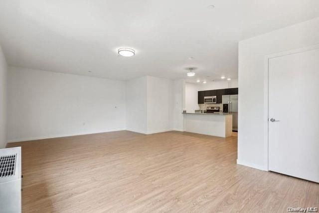 Empty room, Interior, Kitchen, Stainless Steel Appliances, Wood Texture Flooring
