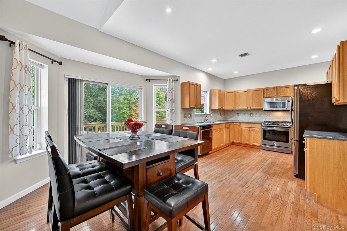 Dining room, Interior, Kitchen, Recessed Lighting, Stainless Steel Appliances, Wood Texture Flooring