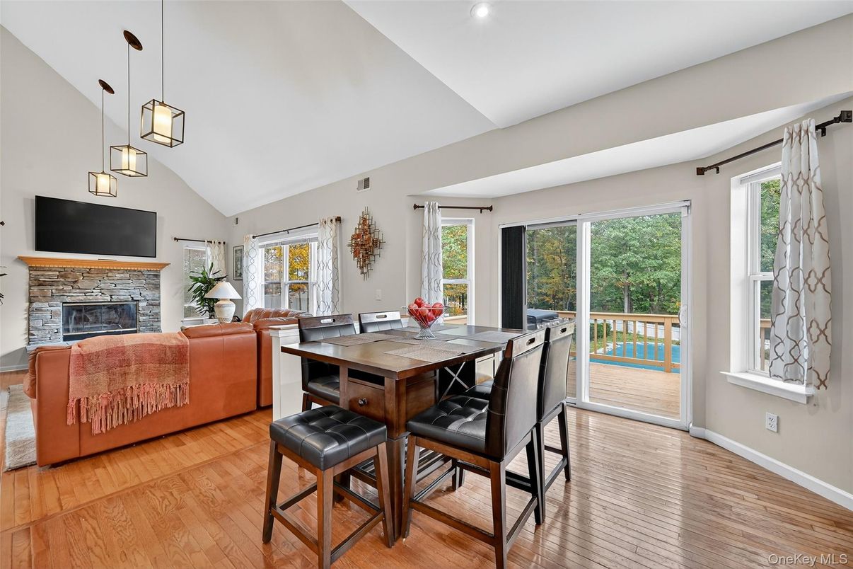 Dining room, Fireplace, Interior, Living room, Pendant Lights, Recessed Lighting, Wood Texture Flooring