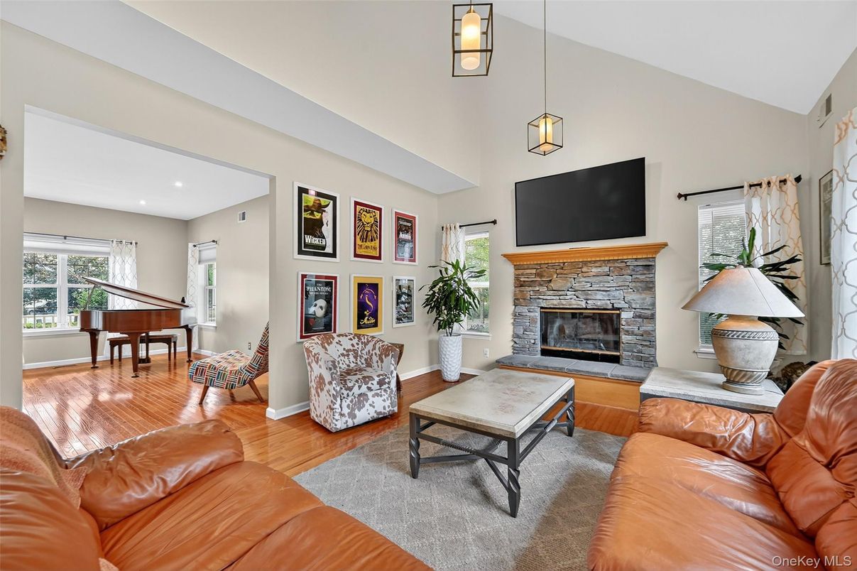 Fireplace, Interior, Living room, Pendant Lights, Piano, Recessed Lighting, Wood Texture Flooring