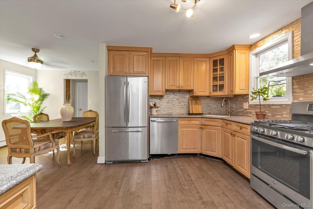 Dining room, Interior, Kitchen, Recessed Lighting, Stainless Steel Appliances, Wood Texture Flooring