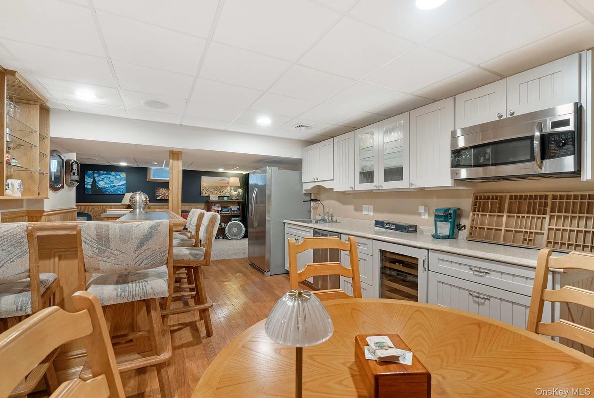 Dining room, Interior, Kitchen, Recessed Lighting, Stainless Steel Appliances, Wood Texture Flooring