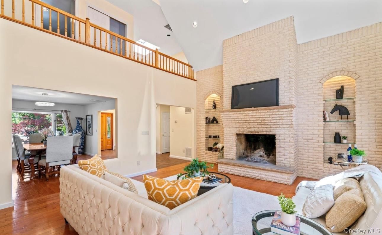 Dining room, Fireplace, Interior, Living room, Recessed Lighting, Stone Walls, Wood Texture Flooring