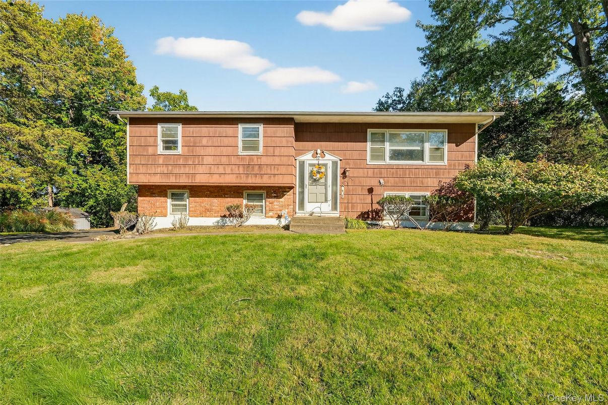 Exterior, Facade, Brick Facade, Raised Ranch