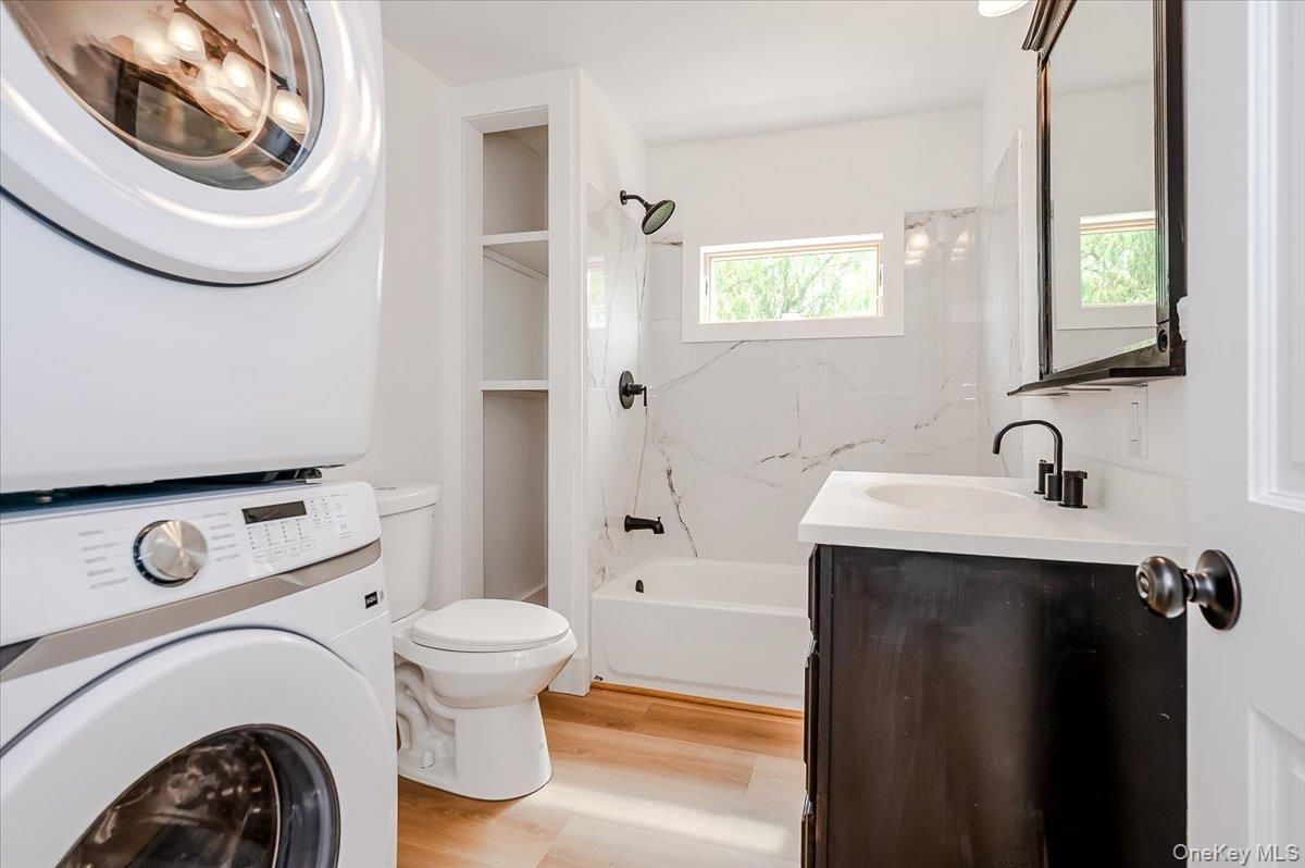 Bathroom, Interior, Marble Walls, Utility Closets, Washer, Wood Texture Flooring