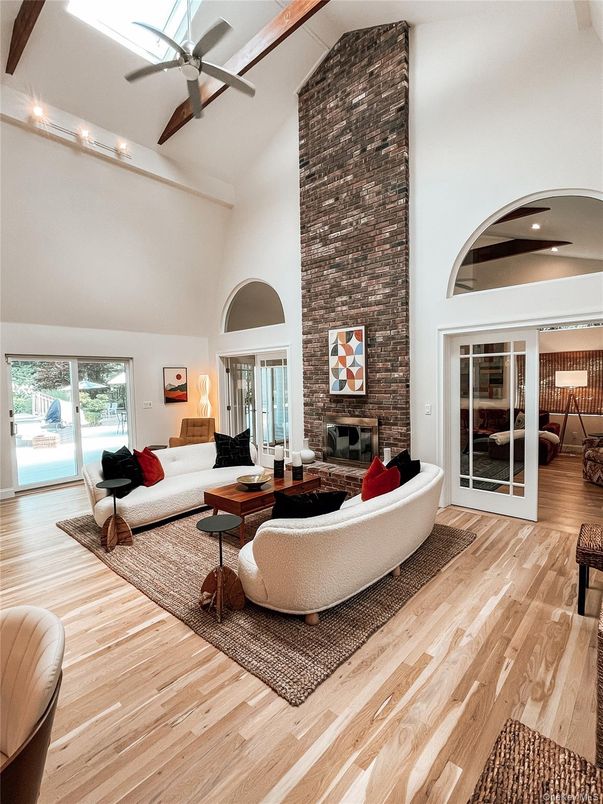 Fireplace, Interior, Living room, Recessed Lighting, Stone Walls, Wood Texture Flooring
