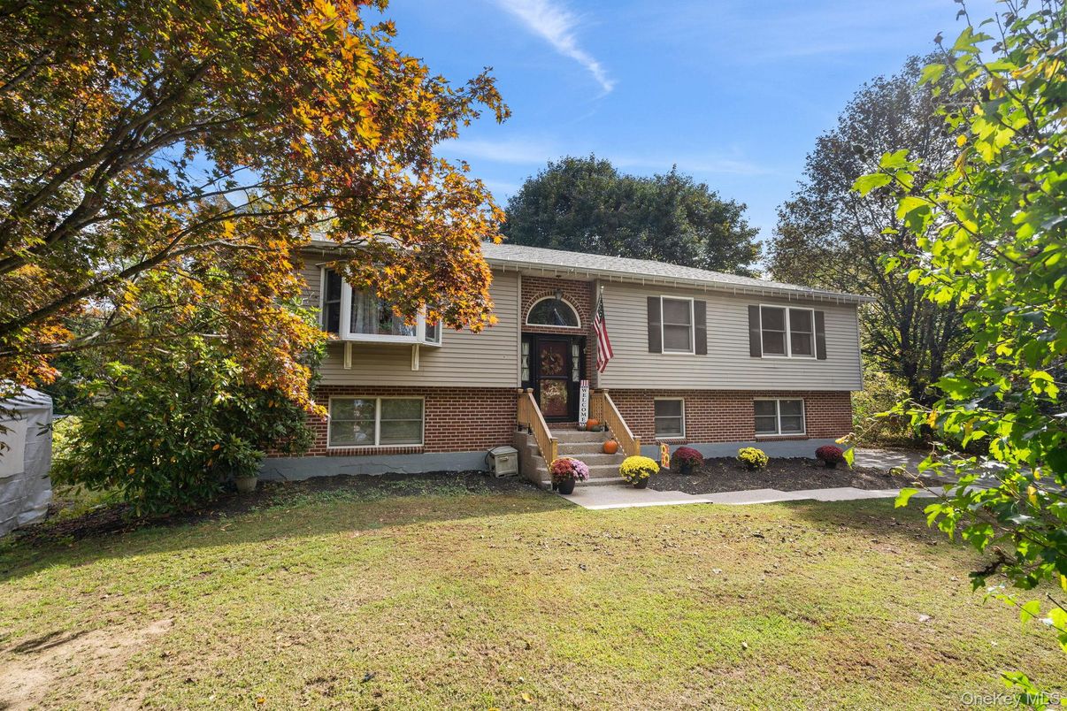 Backyard, Exterior, Facade, Brick Facade, Raised Ranch