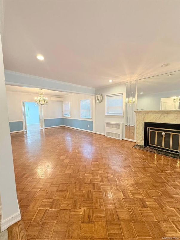 Chandelier, Empty room, Fireplace, Interior, Recessed Lighting, Wood Texture Flooring