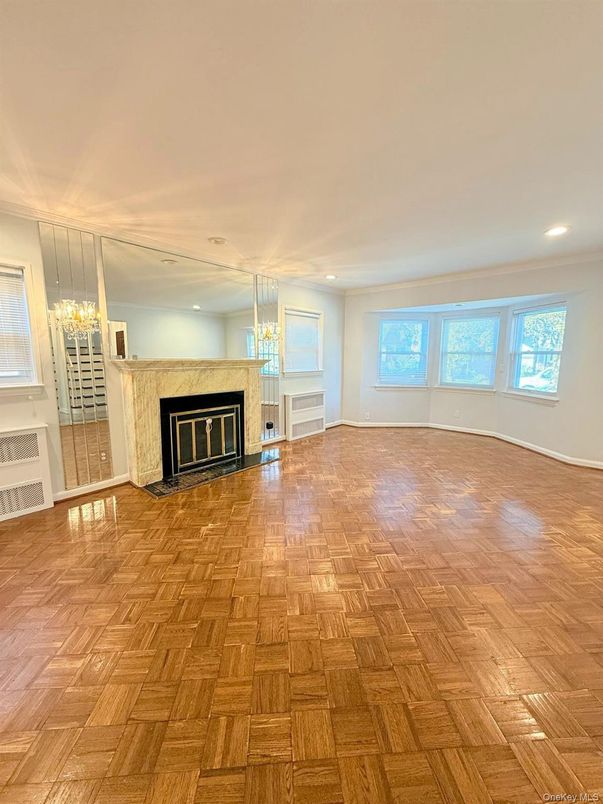 Chandelier, Empty room, Fireplace, Interior, Recessed Lighting, Wood Texture Flooring