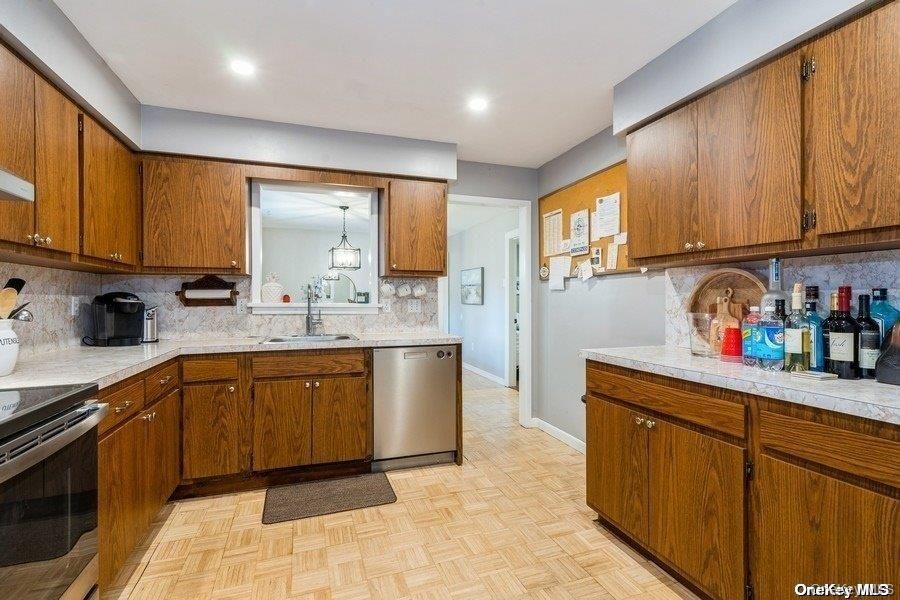 Interior, Kitchen, Pendant Lights, Recessed Lighting, Stainless Steel Appliances, Tile Countertops, Wood Texture Flooring