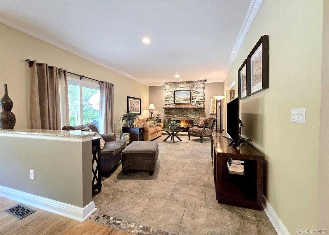 Fireplace, Interior, Living room, Recessed Lighting, Stone Walls, Wood Texture Flooring