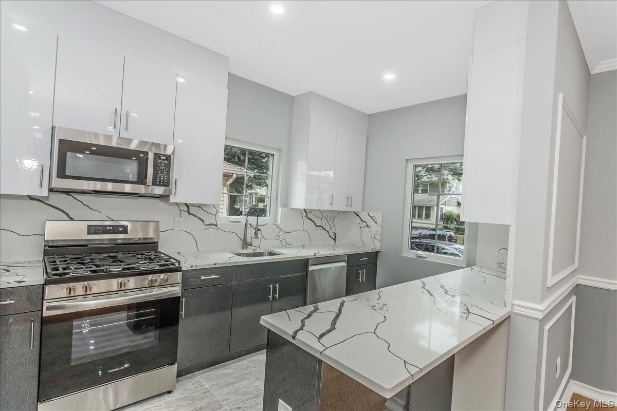 Interior, Kitchen, Marble Walls, Recessed Lighting, Stainless Steel Appliances