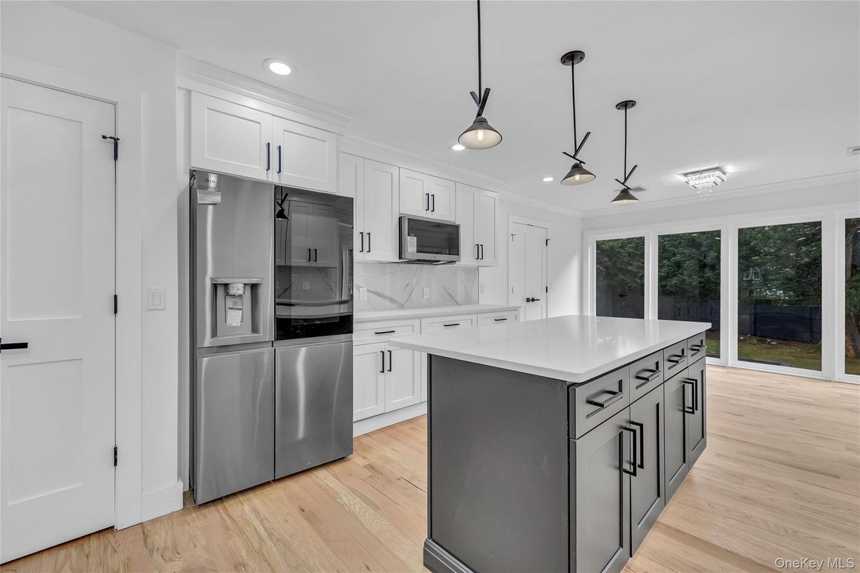Interior, Kitchen, Marble Walls, Pendant Lights, Recessed Lighting, Stainless Steel Appliances, Wood Texture Flooring