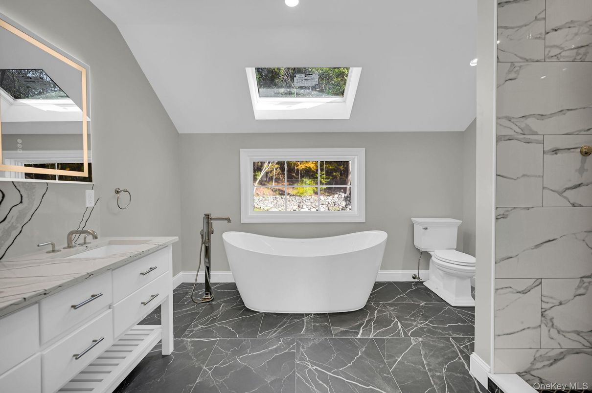 Bathroom, Dual Sink Vanities, Free Standing Baths, Interior, Marble, Marble Walls, Recessed Lighting