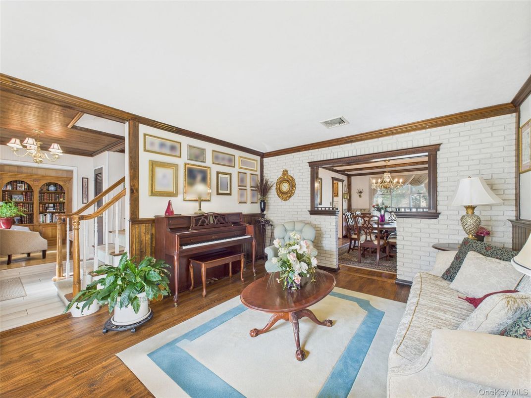 Chandelier, Dining room, Interior, Living room, Piano, Stone Walls, Wood Texture Flooring
