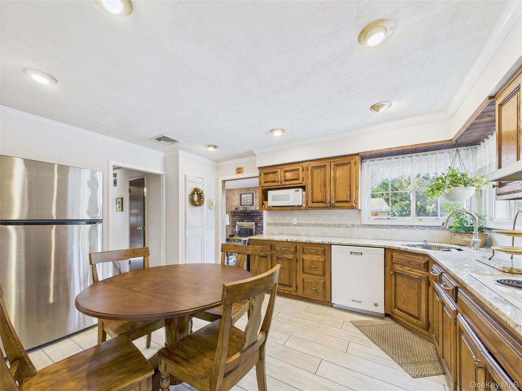 Dining room, Interior, Kitchen, Recessed Lighting, Stainless Steel Appliances, Wood Texture Flooring